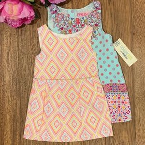 Two Oshkosh dresses 12M and 18M.